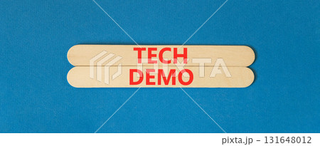 Tech demo symbol. Concept word Tech demo on beautiful wooden sticks. Beautiful blue paper background. Business tech demo concept. Copy space. Tech demo symbol. Concept word Tech demo on beautiful wooden sticks. Beautiful blue paper background. Business tech demo concept. Copy space. 131648012
