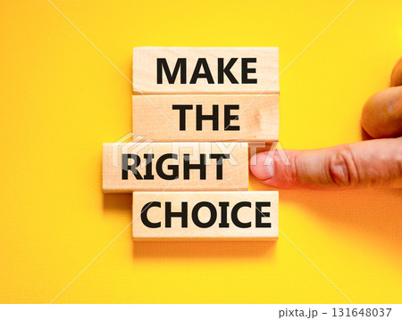 Make the right choice symbol. Concept words phrase Make the right choice on beautiful wooden blocks. Beautiful yellow background. Businessman's hand. Business Make the right choice concept. Copy space Make the right choice symbol. Concept words phrase Make the right choice on beautiful wooden blocks. Beautiful yellow background. Businessman's hand. Business Make the right choice concept. Copy space 131648037