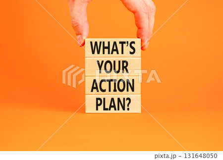 Action plan symbol. Concept words What is your action plan on beautiful wooden blocks. Beautiful orange table orange background. Businessman hand. Business What is your action plan concept. Copy space 131648050