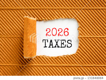 2026 taxes new year symbol. Concept words 2026 taxes on beautiful white paper. Beautiful brown paper background. Business and 2026 taxes new year concept. Copy space. 2026 taxes new year symbol. Concept words 2026 taxes on beautiful white paper. Beautiful brown paper background. Business and 2026 taxes new year concept. Copy space. 131648084