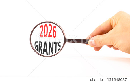 2026 Grants symbol. Concept words 2026 Grants on beautiful white paper. Black magnifying glass. Businessman's hand. Beautiful white paper background. Business and 2026 grants concept. Copy space. 2026 Grants symbol. Concept words 2026 Grants on beautiful white paper. Black magnifying glass. Businessman's hand. Beautiful white paper background. Business and 2026 grants concept. Copy space. 131648087
