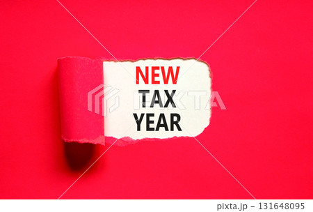 New tax year symbol. Concept words New tax year on beautiful white paper. Beautiful red table red background. Business new tax year concept. Copy space. New tax year symbol. Concept words New tax year on beautiful white paper. Beautiful red table red background. Business new tax year concept. Copy space. 131648095