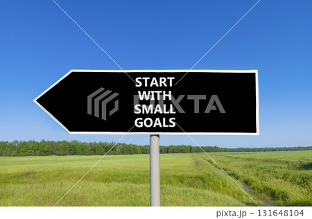 Start with small goals symbol. Concept words phrase Start with small goals on beautiful road sign. Beautiful blue sky green grass lawn background. Business Start with small goals concept. Copy space. 131648104