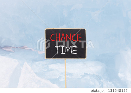Chance time symbol. Concept word Chance time on beautiful black blackboard. Beautiful blue Baikal ice and snow background. Black blackboard. Business chance time concept. Copy space. 131648135