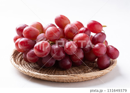 Fresh red grapes in basket on white background, Healthy fruit Fresh red grapes in basket on white background, Healthy fruit 131649379
