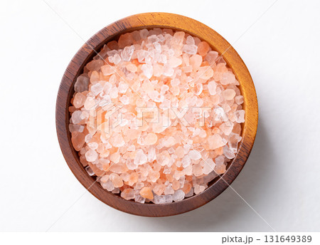 Top view of Himalayan pink salt in wooden bowl on white background, Healthy food ingredient 131649389