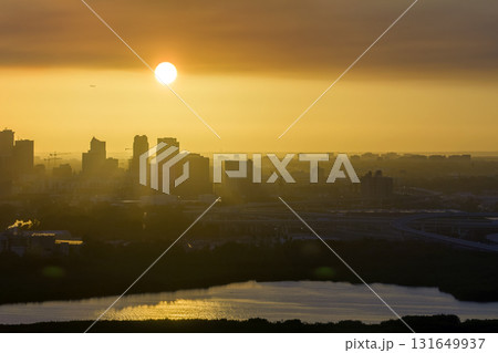 Aerial view of downtown district of Tampa city in Florida, USA at sunset. Dark silhouette of high skyscraper office buildings in modern american midtown 131649937