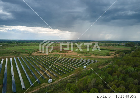 Aerial view of big sustainable electric power plant with many rows of solar photovoltaic panels for producing clean ecological electrical energy. Renewable electricity with zero emission concept 131649955