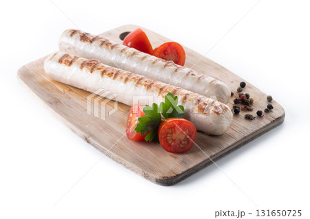 Grilled white sausages with cherry tomatoes and parsley 131650725