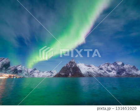 Aurora Borealis in Scandinavia. Norway, Lofoten islands. Northern lights over the mountains. 131651020