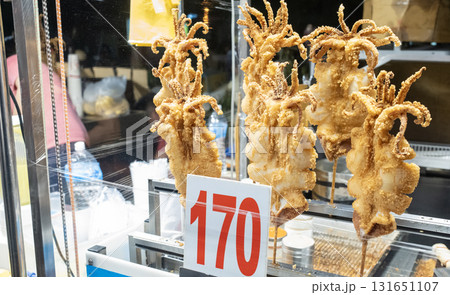 the deep fired squid are sold in Tainan Flower Night Market or Garden night market. it is one of biggest night market in Tainan. the deep fired squid are sold in Tainan Flower Night Market or Garden night market. it is one of biggest night market in Tainan. 131651107