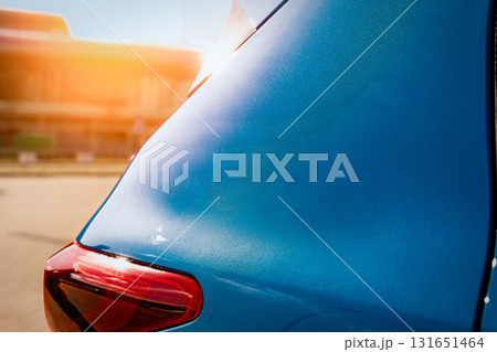 Blue business car with shiny front lights color bright 131651464