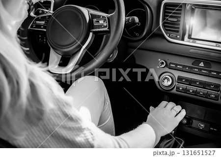 Young woman driving her car Young woman driving her car 131651527