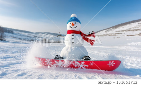 Funny happy snowman on snowboard enjoys winter ride in scenic mountain landscape, concept of Christmas holiday 131651712