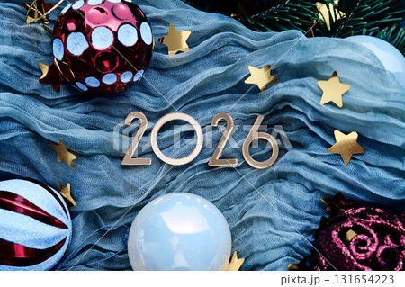New Year's background with the number 2026 on a blue background. New Year's background with the number 2026 on a blue background. 131654223