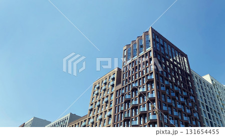 Architecture and real estate, modern residential apartment building with large panoramic windows Architecture and real estate, modern residential apartment building with large panoramic windows 131654455
