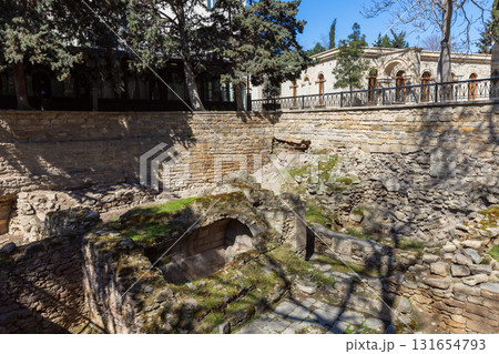 A historic stone ruin beside a raised courtyard in Baku, Azerbaijan A historic stone ruin beside a raised courtyard in Baku, Azerbaijan 131654793