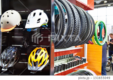 Bicycle helmets and tires in store Bicycle helmets and tires in store 131655049