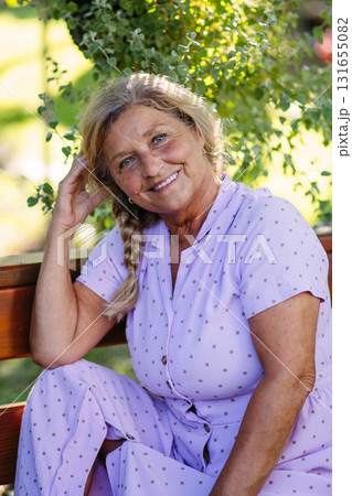 Selfacare moment for elderly woman, quiet time in garden. Selfacare moment for elderly woman, quiet time in garden. 131655082