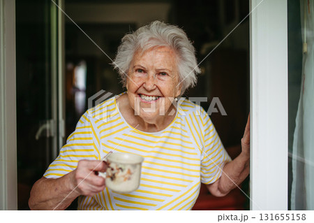Portrait of senior woman with cup of tea. Portrait of senior woman with cup of tea. 131655158