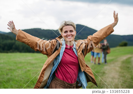 Portrait of beautiful woman during family hiking trip in nature. Portrait of beautiful woman during family hiking trip in nature. 131655228