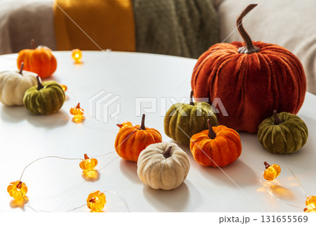 Cozy Autumn Home Decor with Pumpkins and Seasonal Textiles 131655569