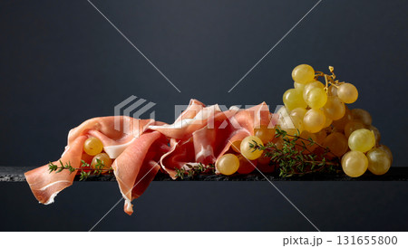 Mediterranean snacks. Grapes with prosciutto and thyme. Mediterranean snacks. Grapes with prosciutto and thyme. 131655800