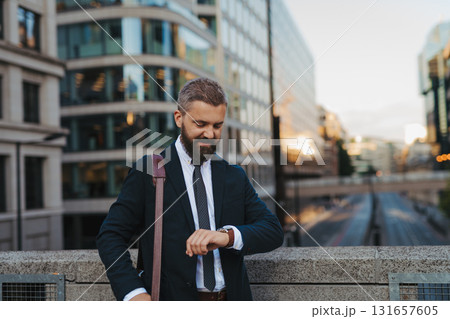 Businessman checking time on his watch. 131657605
