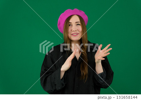 Set of videos featuring young European woman in pink beret showing various emotions and gestures on green chroma key background with copy space for advertising and social media design Set of videos featuring young European woman in pink beret showing various emotions and gestures on green chroma key background with copy space for advertising and social media design 131658144