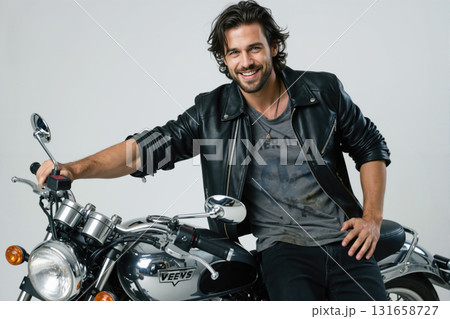 Man on motorcycle smiling. Man on motorcycle smiling. 131658727