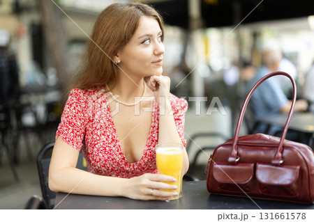 Young woman drinking juice Young woman drinking juice 131661578