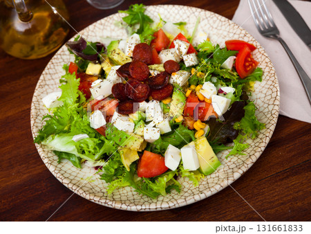 Catalonian salad with sausages, avocado and cheese Catalonian salad with sausages, avocado and cheese 131661833
