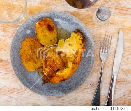 Fried chicken piece and potato slices in the plate Fried chicken piece and potato slices in the plate 131661855