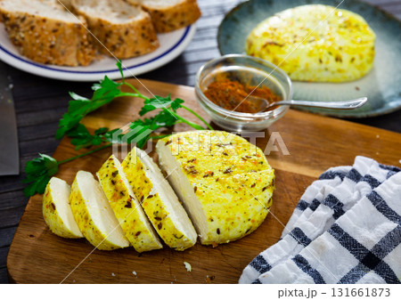Fried cottage cheese with turmeric. Traditional Lithuanian dish Fried cottage cheese with turmeric. Traditional Lithuanian dish 131661873
