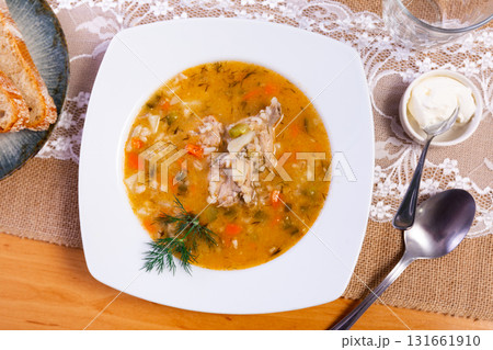 National Russian dish is Pickle soup with meat, cooked on basis of pickled cucumbers and pearl barley National Russian dish is Pickle soup with meat, cooked on basis of pickled cucumbers and pearl barley 131661910