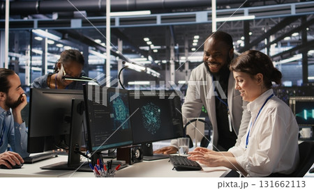 Joyous data center team leader giving high five to worker after successful infrastructure upgrade. Pleased coworkers celebrating collaborative achievement during AI systems deployment, camera A 131662113