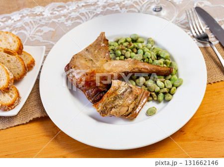 Dish of stewed rabbit with with beans and parsley 131662146