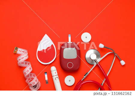 Diabetes management tools arranged on a bright orange background Diabetes management tools arranged on a bright orange background 131662162