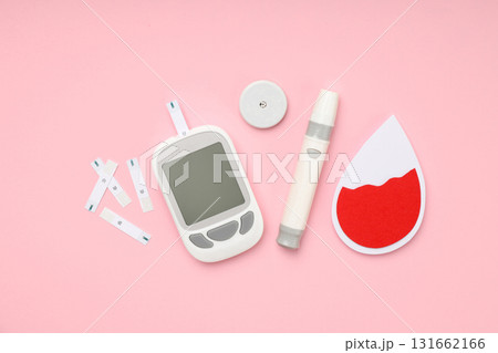 Various diabetes management tools on a pink background 131662166