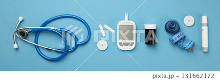 Diabetes tools organized on a blue surface Diabetes tools organized on a blue surface 131662172