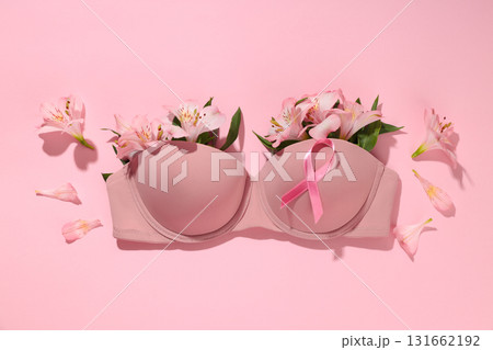 Bra arranged with flowers and pink ribbon promoting awareness Bra arranged with flowers and pink ribbon promoting awareness 131662192