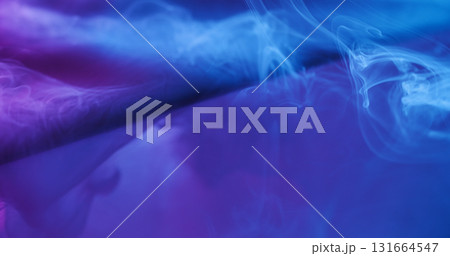 Paint mist. Neon water splash. Defocused blue purple color liquid glass texture spill on abstract acrylic light creative background. Paint mist. Neon water splash. Defocused blue purple color liquid glass texture spill on abstract acrylic light creative background. 131664547