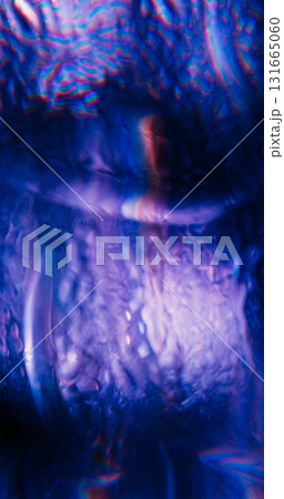 Defocused crystal flare. Optical ray. Purple blue color dazzle vibrant rainbow texture on abstract visual luminous bokeh background. 131665060