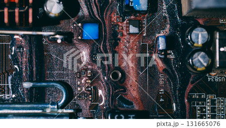 Acrylic ink. Circuit board. Blur orange blue colorful glitter liquid microchip dark black water on abstract electronic background. 131665076