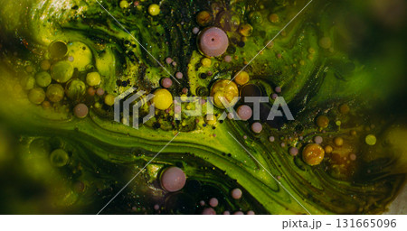 Ink stream. Acrylic bubbles. Defocused yellow green purple color oil sparkling texture round glitter liquid circle on abstract art bokeh background. Ink stream. Acrylic bubbles. Defocused yellow green purple color oil sparkling texture round glitter liquid circle on abstract art bokeh background. 131665096