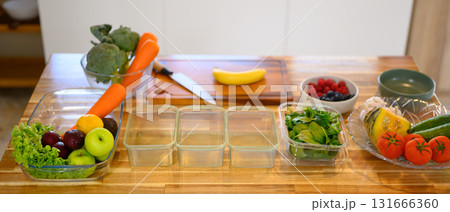 Fresh fruits and vegetables arranged on a kitchen counter for weekend meal prep Fresh fruits and vegetables arranged on a kitchen counter for weekend meal prep 131666360
