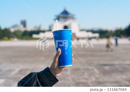 woman hand holding Pearl milk tea with tapioca ball traveler at National Chiang Kai shek Memorial, Chun Shui Tang brand a famous Taiwanese bubble tea of Taiwan. Taipei, Taiwan, 12 January 2025 woman hand holding Pearl milk tea with tapioca ball traveler at National Chiang Kai shek Memorial, Chun Shui Tang brand a famous Taiwanese bubble tea of Taiwan. Taipei, Taiwan, 12 January 2025 131667084