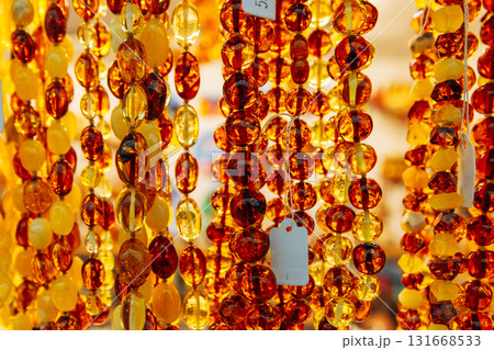 Amber Beads in a Street Shop. Orange Baltic Sea Souvenir, Natural Jewelry, Gold Brown Stone Necklace 131668533