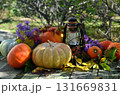 Vintage still life with pumpkins, flowers and decorations outside, thanksgiving day background, autumn calendar season concept Vintage still life with pumpkins, flowers and decorations outside, thanksgiving day background, autumn calendar season concept 131669831
