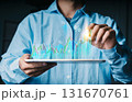 Hand holding a tablet displaying a financial candlestick chart with rising percentage and dollar symbols. Concept of stock market and financial growth. 131670761
